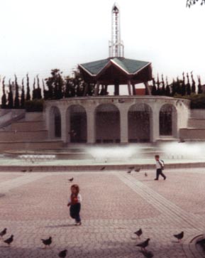 Kids run through the city.